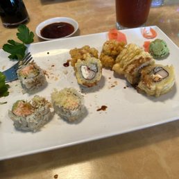 Sushi rolls.  Spider roll and H12. California Roll