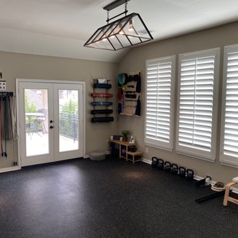 Grand Floors & More - a gym room with a door leading to a patio - Flooring Near Me - Katy, Texas Grand Floors & More - a gym room with a door leading to a patio - Flooring Near Me - Katy, Texas