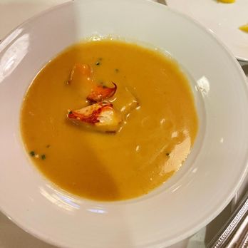 Eddie V's Prime Seafood - Lobster bisque soup with seafood garnish - Seafood Near Me - Orlando, Florida