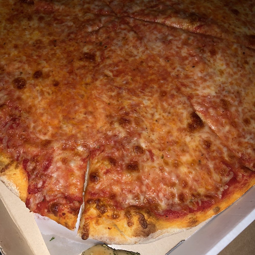 Regular Pizza Pie with a little surprise garlic knot