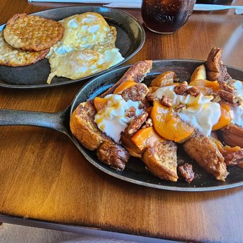 Two Cracked Eggs Cafe - Peach French toast comes with 2 eggs and either sausage or bacon. The sausage was awesome! - Breakfast & Brunch Near Me - Savannah, Georgia Two Cracked Eggs Cafe - Peach French toast comes with 2 eggs and either sausage or bacon. The sausage was awesome! - Breakfast & Brunch Near Me - Savannah, Georgia