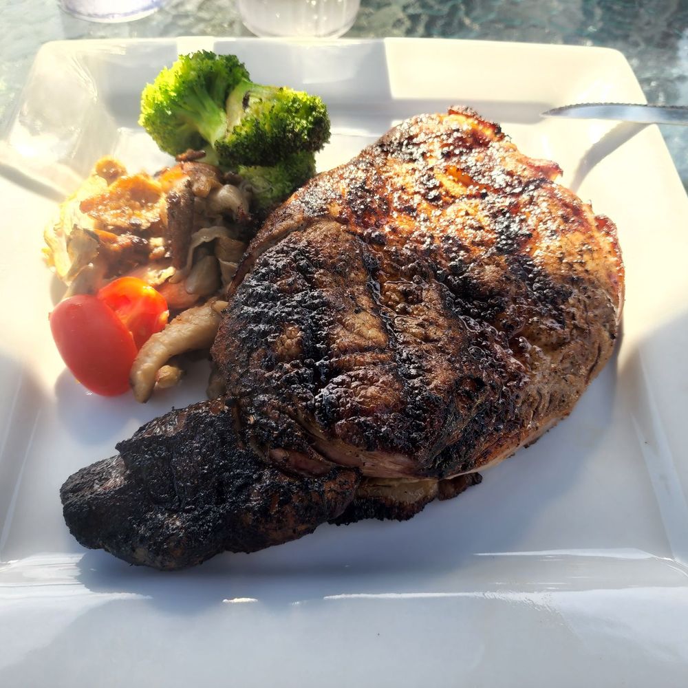 Ribeye no mashed potatoes. Cooked perfectly medium rare.