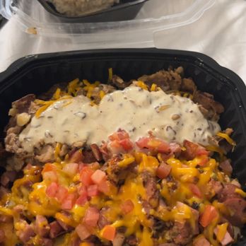 Biscuit & Hogs - The Farmhouse with biscuits and gravy and hog style Idaho fries - New American Near Me - Meridian, Idaho