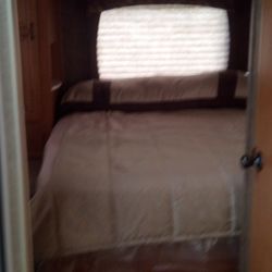 Four Seasons RV Rental - Separate Bedroom in the back of the R.V. along with a shower, and access to the bathroom.