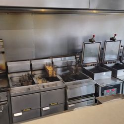 Bresina's Carry Out - The grill, deep fryers, and pressure cookers