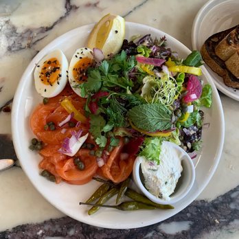 Great White - Salmon mezze comes with slices of sourdough bread. Savory and bright acidic flavors. Vibrant plate of food that smiles back at you - New American Near Me - Los Angeles, California