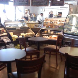 Small seating area by sandwich counter. Small seating area by sandwich counter.