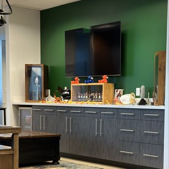 Alpha 1 Tax & Wealth - Waiting area with Bronco memorabilia (Terrell Davis is a partner) - Financial Advising Near Me - Denver, Colorado Alpha 1 Tax & Wealth - Waiting area with Bronco memorabilia (Terrell Davis is a partner) - Financial Advising Near Me - Denver, Colorado