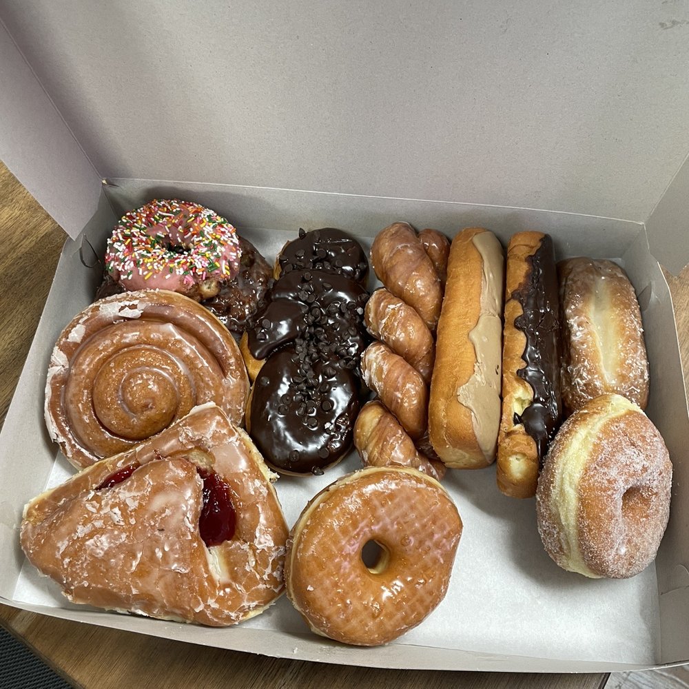 Billy & Emily Donuts - 11 out of 12. I couldn't help myself hahaha. Sorry you didn't get to see the full dozen! - Donuts Near Me - Orland, California