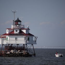 Yacht Charters on the Bay - Thomas lighthouse and Francis Scott Key Bridge