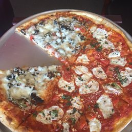 Half margarita and half chef special largest pizza Half margarita and half chef special largest pizza