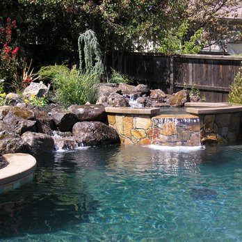 Erik Johnson Tile - Moss Rock waterfall with Golden Plains tile and Gold Quartzite flagstone - General Contractors Near Me - Orangevale, California