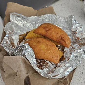 Parceros Bakery - two pastries wrapped in tin foil - Bakeries Near Me - Rego Park, New York