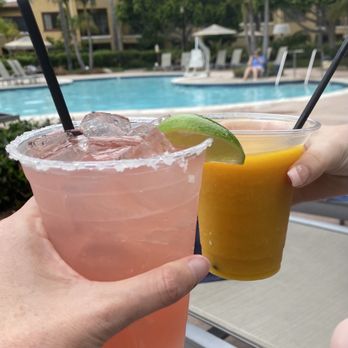 The Cove Bar and Grill - two people holding drinks - Salad Near Me - Carlsbad, California The Cove Bar and Grill - two people holding drinks - Salad Near Me - Carlsbad, California