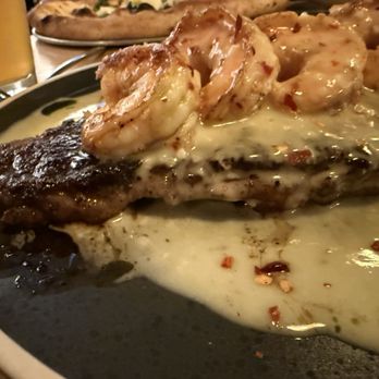 In Bocca Al Lupo - Ribeye steak topped with shrimp scampi - Italian Near Me - Juneau, Alaska In Bocca Al Lupo - Ribeye steak topped with shrimp scampi - Italian Near Me - Juneau, Alaska