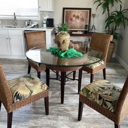King's Rattan - Dining set with 48 " glass. It's lovely. The chairs are so comfortable