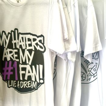 Live A Dream - White graphic tee with a bold "My Haters Are My #1 Fan" slogan and Live A Dream branding. - Art Galleries Near Me - Los Angeles, California Live A Dream - White graphic tee with a bold "My Haters Are My #1 Fan" slogan and Live A Dream branding. - Art Galleries Near Me - Los Angeles, California