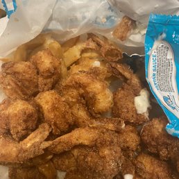 a bag of fried fish and chips a bag of fried fish and chips