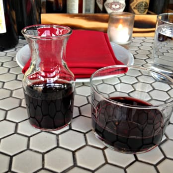 Artusi - Happy hour wine served in a mini carafe. - Italian Near Me - Seattle, Washington