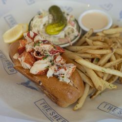 The Shed Restaurant - Mohegan Sun CT - A classic you can't go wrong with Our Lobster Roll is piled high with tender lobster and served with crispy fries and all the fixings.