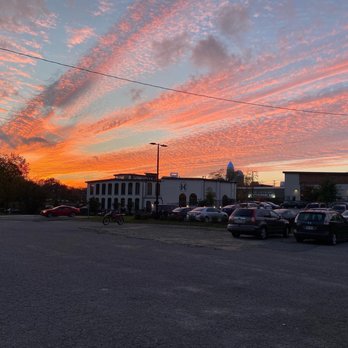 Two Buck Saloon - a parking lot at sunset - Bars Near Me - Charlotte, North Carolina Two Buck Saloon - a parking lot at sunset - Bars Near Me - Charlotte, North Carolina
