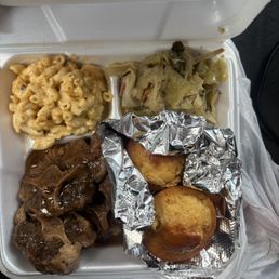 Mashed potatoes are underneath the corn bread I couldn't get past the oxtails & cabbage etc lol Mashed potatoes are underneath the corn bread I couldn't get past the oxtails & cabbage etc lol