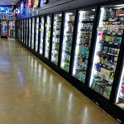 Premium Package Outlet - Large cooler section with variety of cold drinks along with a large walk-in beer cooler at the end.