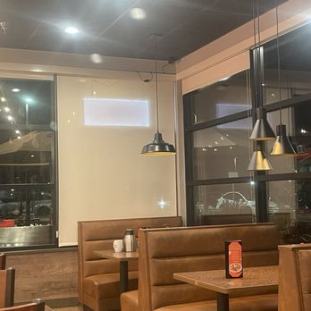 Denny's - The brand new bouncy booth table with the various interior hanging lights and a projector screen on the window and hanging blinds. - Diners Near Me - Brentwood, California Denny's - The brand new bouncy booth table with the various interior hanging lights and a projector screen on the window and hanging blinds. - Diners Near Me - Brentwood, California