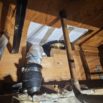 Bath Fitter - 2 inch shower drain choked down to 1 1/4 copper drain. S style trap has been banned since the 1940's, overnotched floor joist. - General Contractors Near Me - Lenexa, Kansas