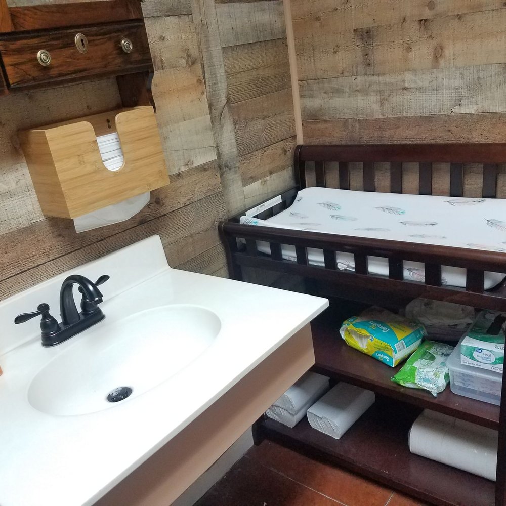 Clippers & Blade - These guys thought of everything! Baby changing station in the bathroom! - Barbers Near Me - Weatherford, Texas