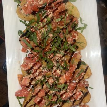 Stuft Pizza Bar & Grill - Tomato Bruschetta - Pizza Near Me - La Quinta, California Stuft Pizza Bar & Grill - Tomato Bruschetta - Pizza Near Me - La Quinta, California