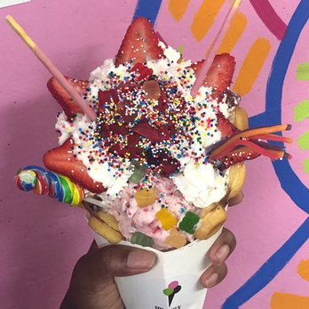 Midtown Creamery - Raspberry Sorbet and Strawberry ice cream in a bubble cone topped with strawberries, whip cream, gummy bears, lollipop and picky sticks - Desserts Near Me - Miami, Florida