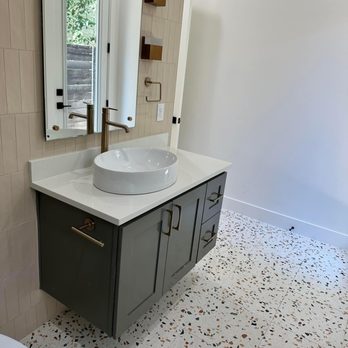 GoBa Elite Builders - a bathroom with a sink and mirror - General Contractors Near Me GoBa Elite Builders - a bathroom with a sink and mirror - General Contractors Near Me