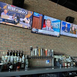 A seat at the bar and plenty of televisions