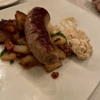 Nick’s German Kitchen - Bavarian bratwurst with bacon fried potatoes and creamy sauerkraut - Modern European Near Me - Mount Pleasant, South Carolina Nick’s German Kitchen - Bavarian bratwurst with bacon fried potatoes and creamy sauerkraut - Modern European Near Me - Mount Pleasant, South Carolina