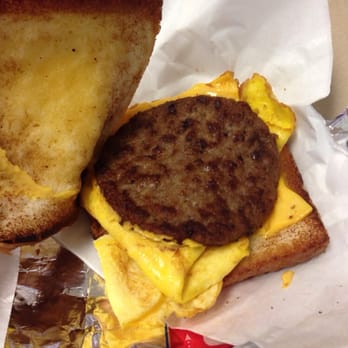 Sonic Drive-In - What the heck is going on in here? Cold sausage patty and a wad of overcooked eggs. - Burgers Near Me - San Diego, California
