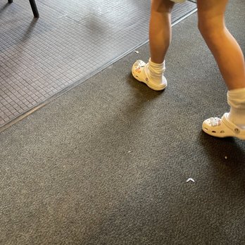 Turtle's Bar & Grill - a person walking on the floor - Sports Bars Near Me - Shakopee, Minnesota