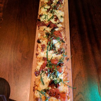 Seasons 52 - Roma tomato flatbread! Yummy! Only 380 calories! - New American Near Me - Raleigh, North Carolina Seasons 52 - Roma tomato flatbread! Yummy! Only 380 calories! - New American Near Me - Raleigh, North Carolina