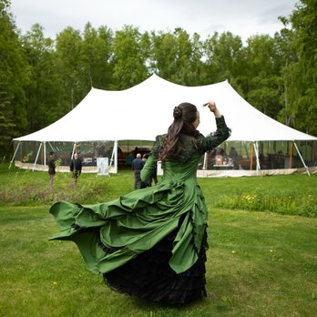 Wilmington Wedding Venue - Taking my wedding dress for a whirl before changing out and joining my reception party. The big tent in background down gentle slope. - Wedding Chapels Near Me - Wasilla, Alaska