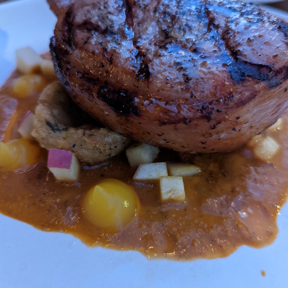 Penca - Chuleta bone in pork chop on pumpkin mole was superb, juicy and nicely charred - Mexican Near Me - Tucson, Arizona