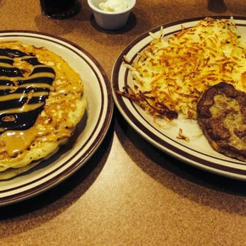 Denny's - Peanut Butter Cup pancakes with hash browns, scrambled eggs and chicken sausage. - Diners Near Me - Schiller Park, Illinois Denny's - Peanut Butter Cup pancakes with hash browns, scrambled eggs and chicken sausage. - Diners Near Me - Schiller Park, Illinois