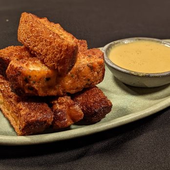 The Monkey King - Shrimp Toast: Crispy Outside with delicious shrimp goodness I side paired with a coconut curry sauce! - Chinese Near Me - Brooklyn, New York The Monkey King - Shrimp Toast: Crispy Outside with delicious shrimp goodness I side paired with a coconut curry sauce! - Chinese Near Me - Brooklyn, New York