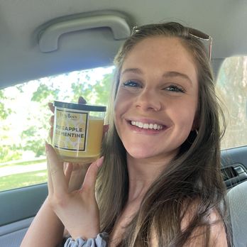 Lazy Bear Winery - a woman in a car holding a jar of honey - Wineries Near Me - Easley, South Carolina