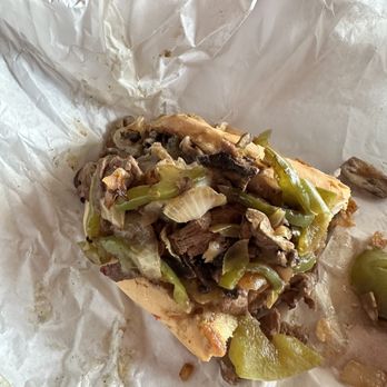 Mega Burgers - What it got vs what I ordered (thin cut Philly cheesesteak with yellow cheese. No onions or raw peppers is what shown on the menu.) - Burgers Near Me - Yucaipa, California