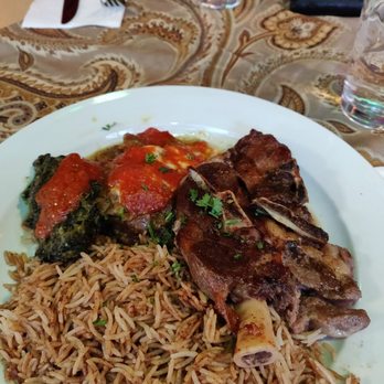 Afghan Horsemen Restaurant - Lamb shoulder with badenjan borani (baked eggplant) - Middle Eastern Near Me - Vancouver, British Columbia Afghan Horsemen Restaurant - Lamb shoulder with badenjan borani (baked eggplant) - Middle Eastern Near Me - Vancouver, British Columbia