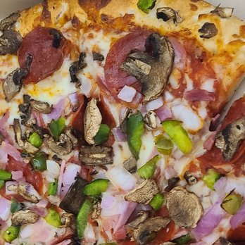 Hungry Howie's Pizza & Subs - Closeup of one of the best chain "Works" pies available. Check out those red onion's! - Pizza Near Me - Avon Park, Florida