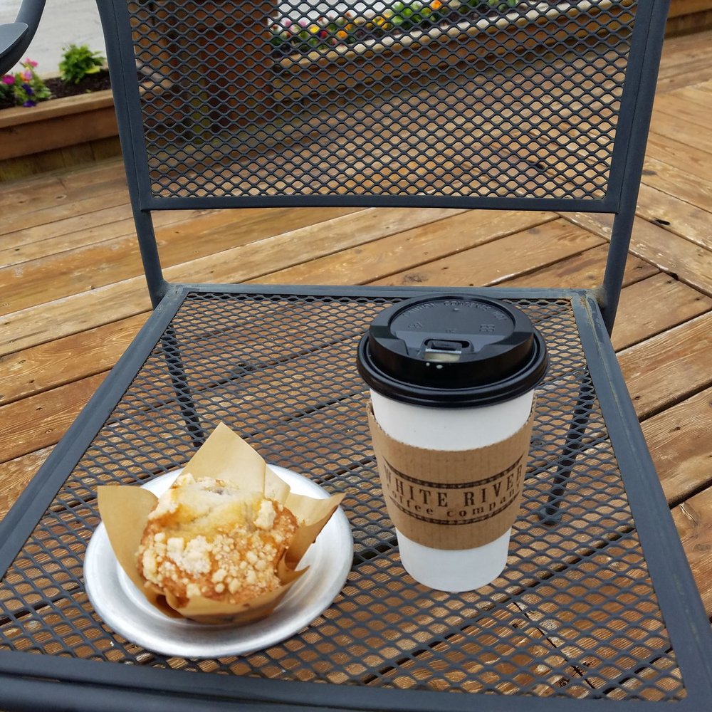 Enjoying a blueberry muffin and latte while listening to the birds Enjoying a blueberry muffin and latte while listening to the birds