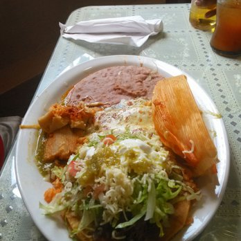 La Tortilandia - Mexican dinner plate. This was actually super good. It's a beef tostada, 2 tamales, and 2 enchiladas. - Mexican Near Me - Fort Worth, Texas La Tortilandia - Mexican dinner plate. This was actually super good. It's a beef tostada, 2 tamales, and 2 enchiladas. - Mexican Near Me - Fort Worth, Texas