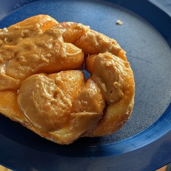 Donut Haus - Maple Pretzel -- but it's really a cinnamon twist shaped like a pretzel topped with maple frosting - Bakeries Near Me - Estes Park, Colorado