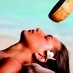 Spavia Day Spa - Sandy - Fajiian warm oil scalp treatment applied with a coconut bowl.